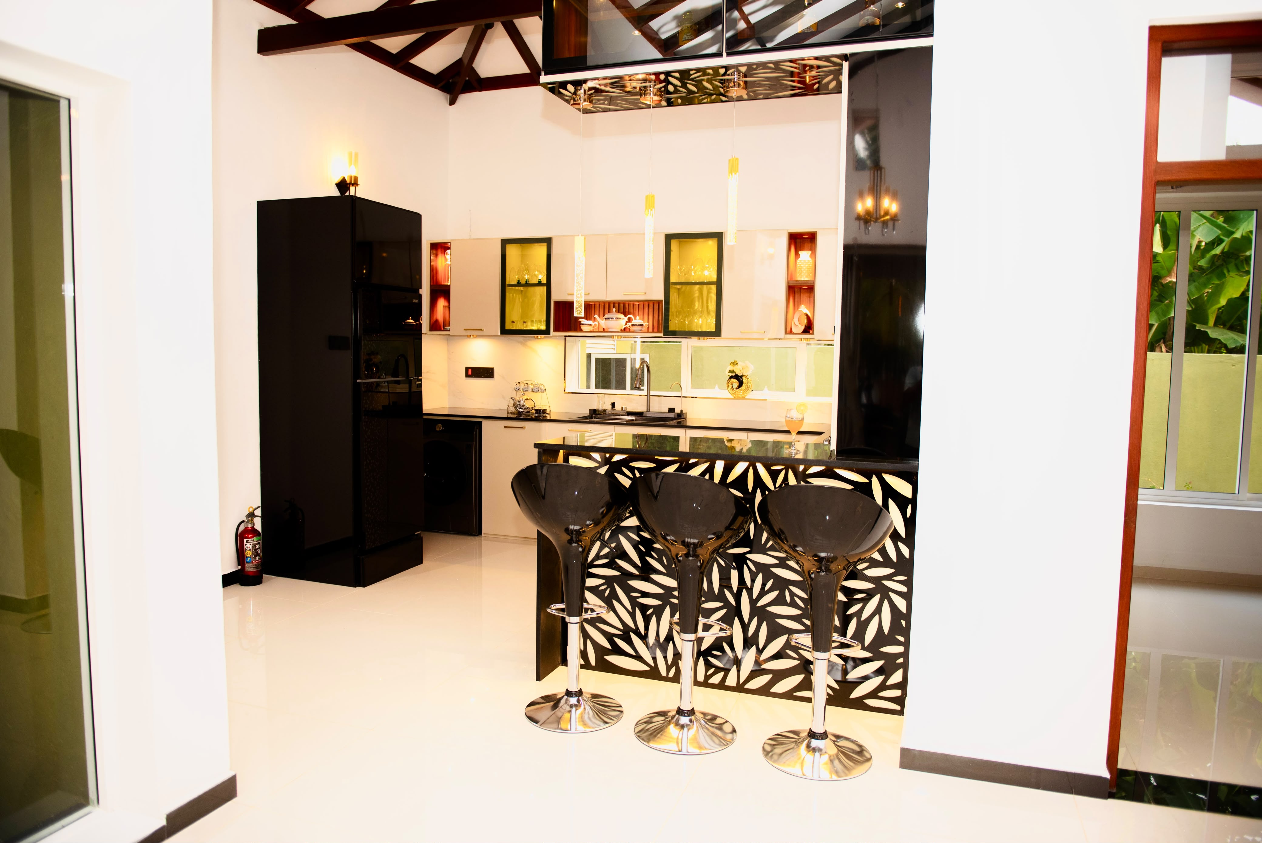 Modern kitchen with bar counter and leaf-patterned facade